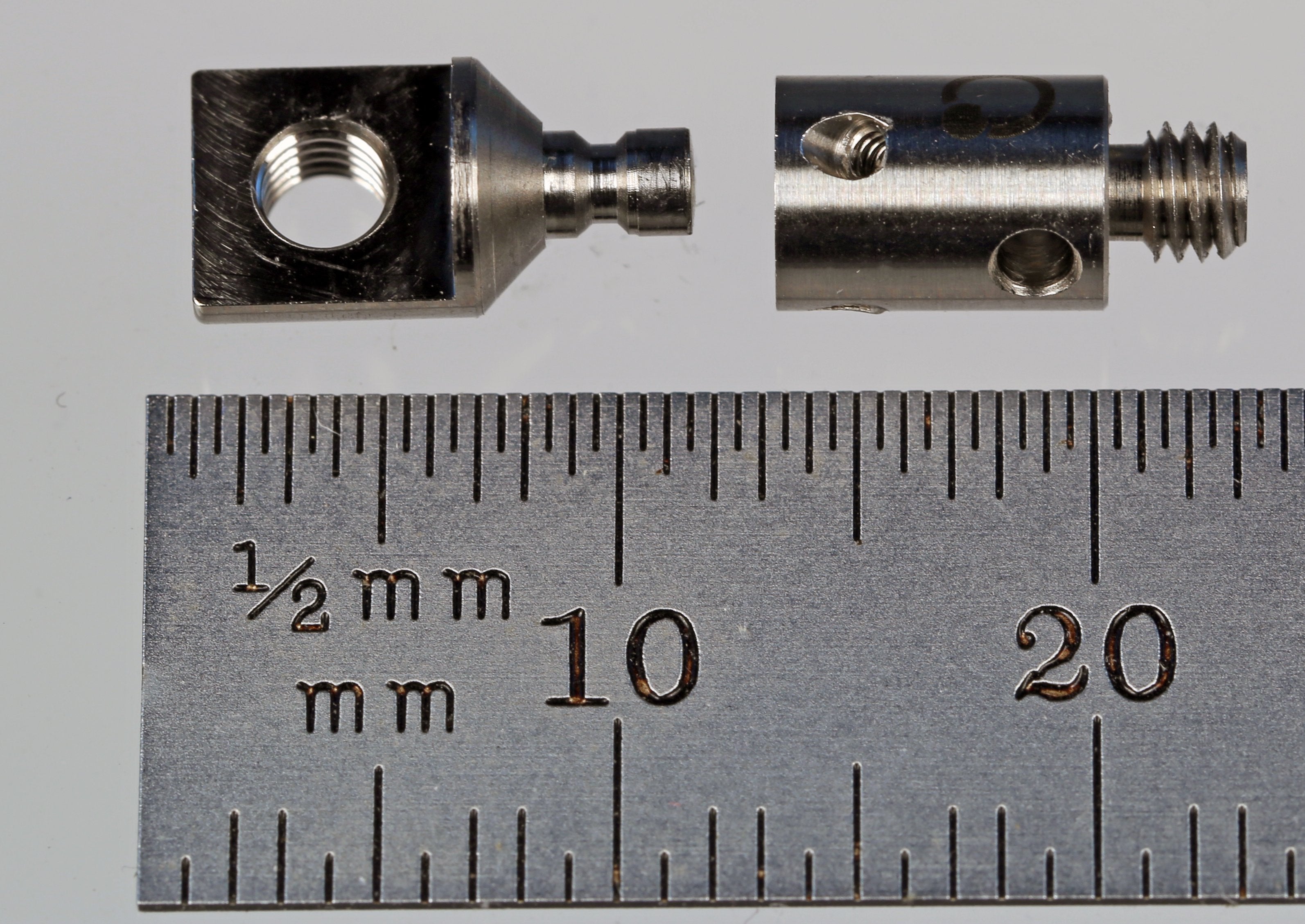 RAP-5PF-90A M3 rotating right angle adapter, titanium and stainless steel, by Q-Mark Manufacturing, Inc.