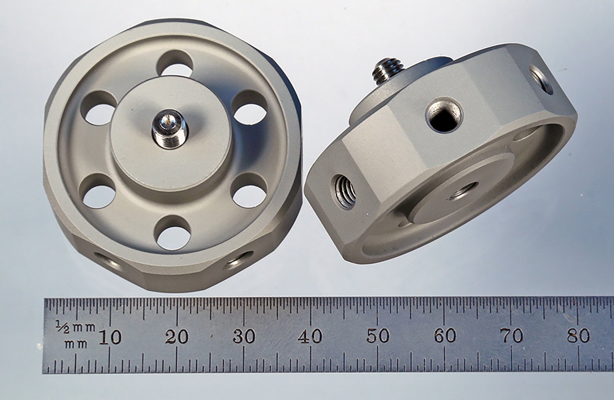 HUB-6 M5 hard anodized aluminum hub with six radial and one axial tapped holes.