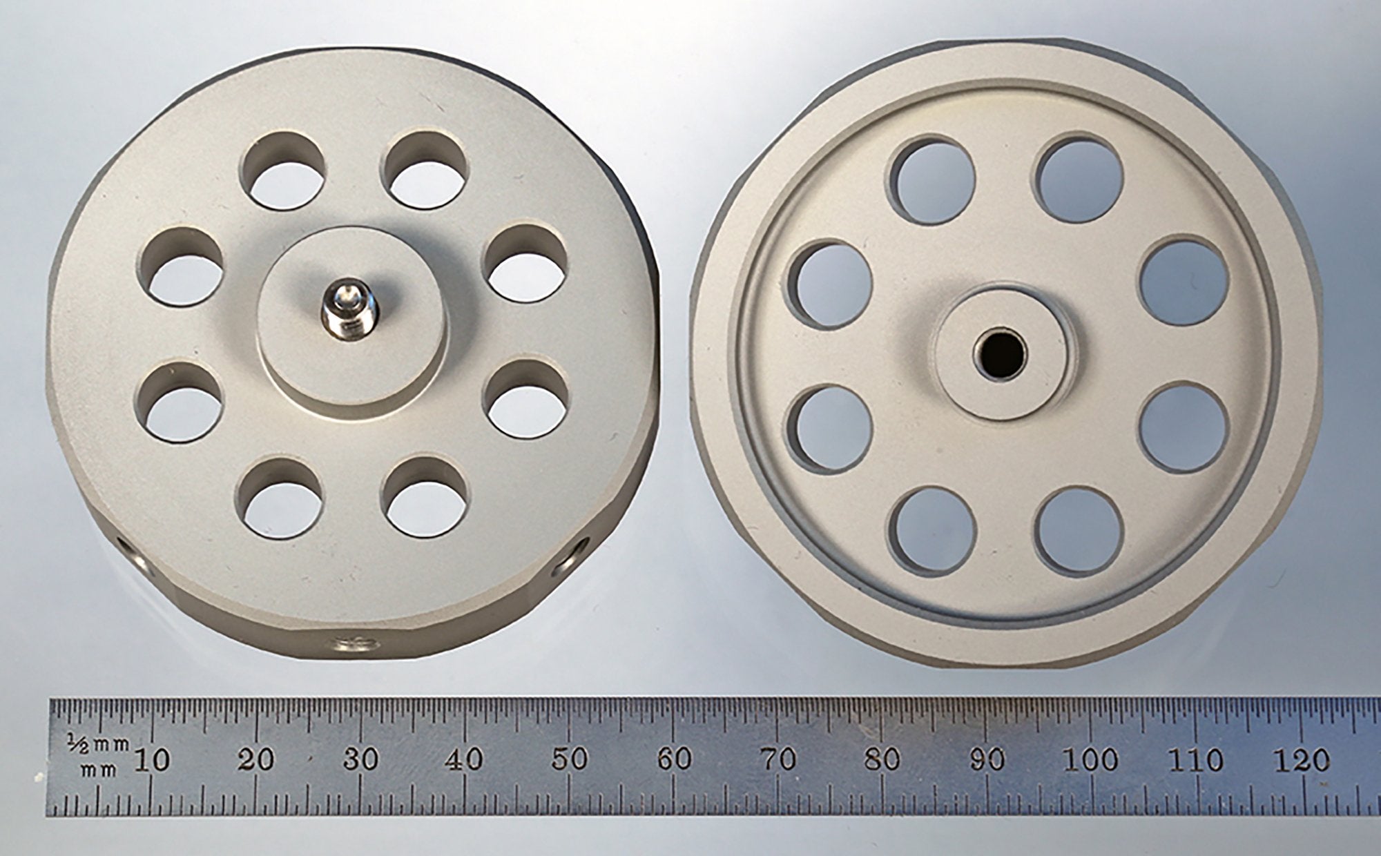HUB-8 M5 hard anodized aluminum hub with eight radial and one axial tapped holes.
