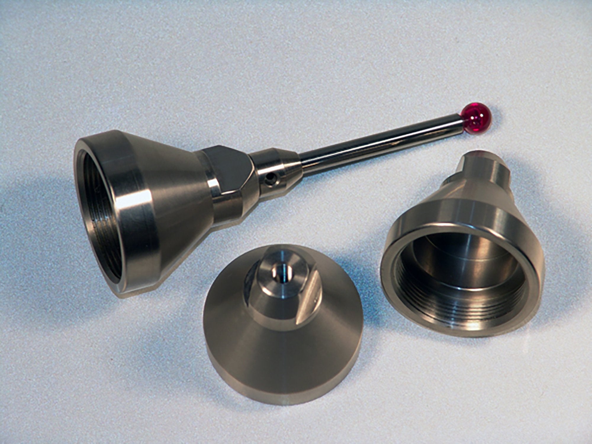 QFT-M5 FARO 1-1/4"-20 female to M5 x 0.8 female thread adapter, silver metal.