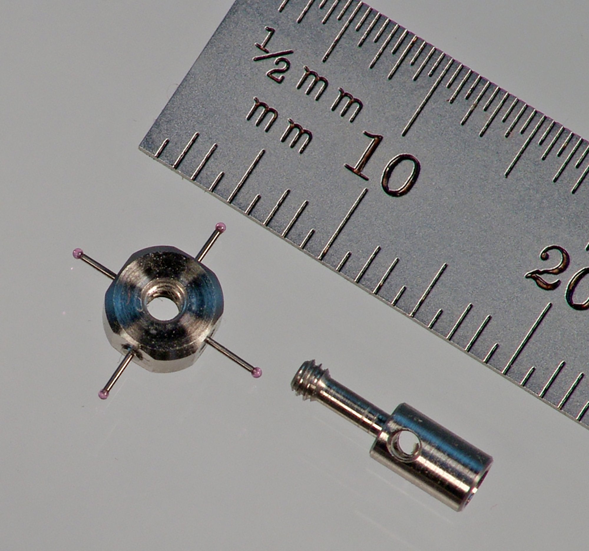 M2 star stylus with four 0.5 mm diameter ruby balls. Fully adjustable. 10.0 mm between ball centers. Stainless steel hub and screw. 0.3 mm diameter carbide stems. Total weight is 0.72 gram. Compare to Renishaw A-5003-4011.