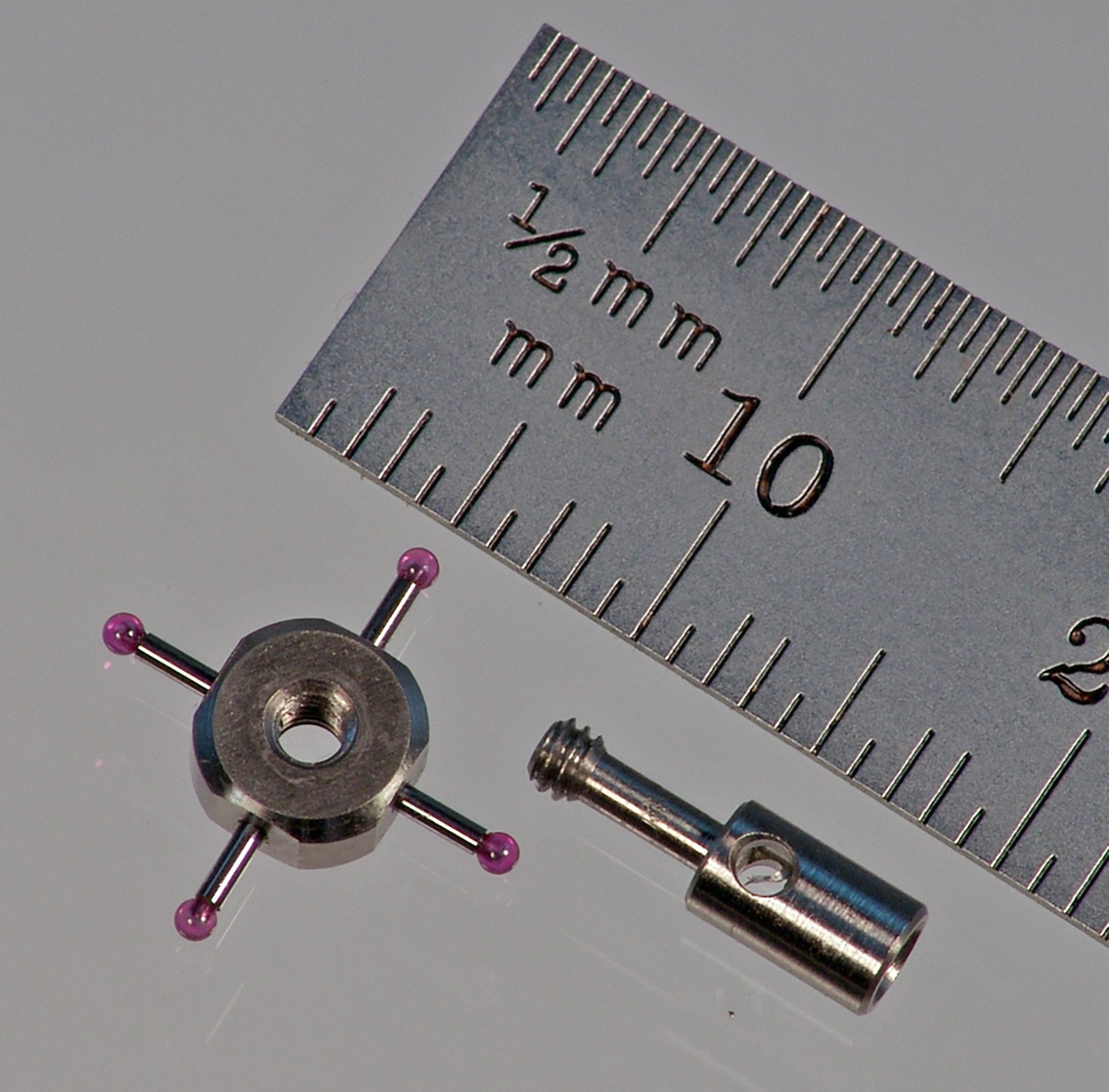 M2 star stylus with four 1.0 mm diameter ruby balls and 0.7 mm diameter carbide stems. Fully adjustable. 10.0 mm between ball centers. Stainless steel. Weight is 0.71 gram. Compare to Renishaw A-5000-7811 and Mitutoyo K651052.