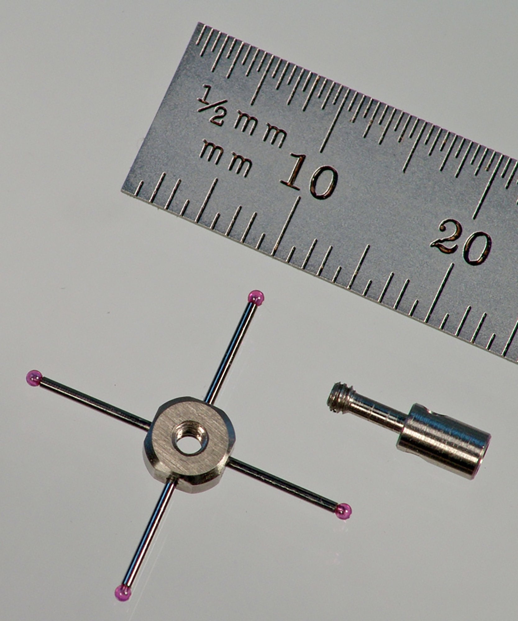 M2 star stylus with four 1.0 mm diameter ruby balls. Fully adjustable. 20.0 mm between ball centers. Stainless steel fittings with 0.7 mm diameter carbide stems. Weight is 0.82 gram. Compare to Renishaw A-5003-4788.