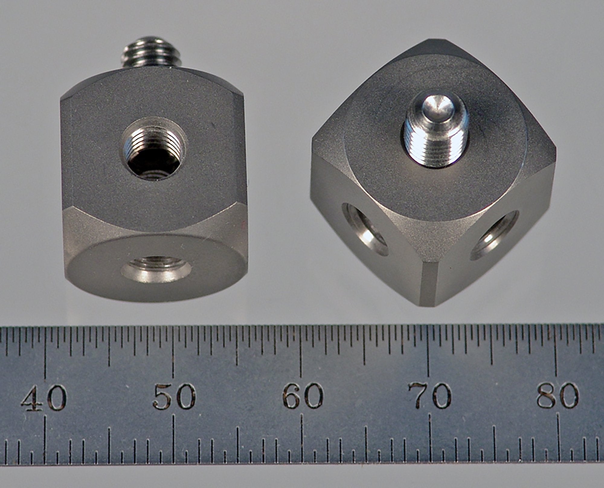 WM5-15-T M5 cube, 90 degree, solid titanium with stainless steel M5 screw, 15.0 mm thickness by Q-Mark Manufacturing, Inc.