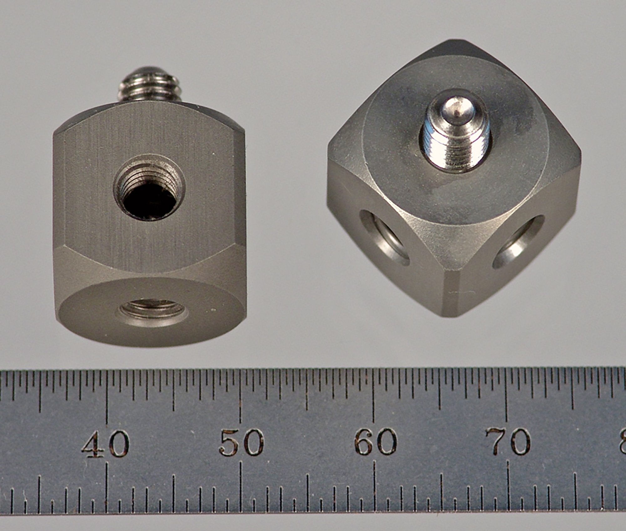 WM5-15 M5 cube, 90-degree, hard anodized aluminum with stainless steel M5 screw.