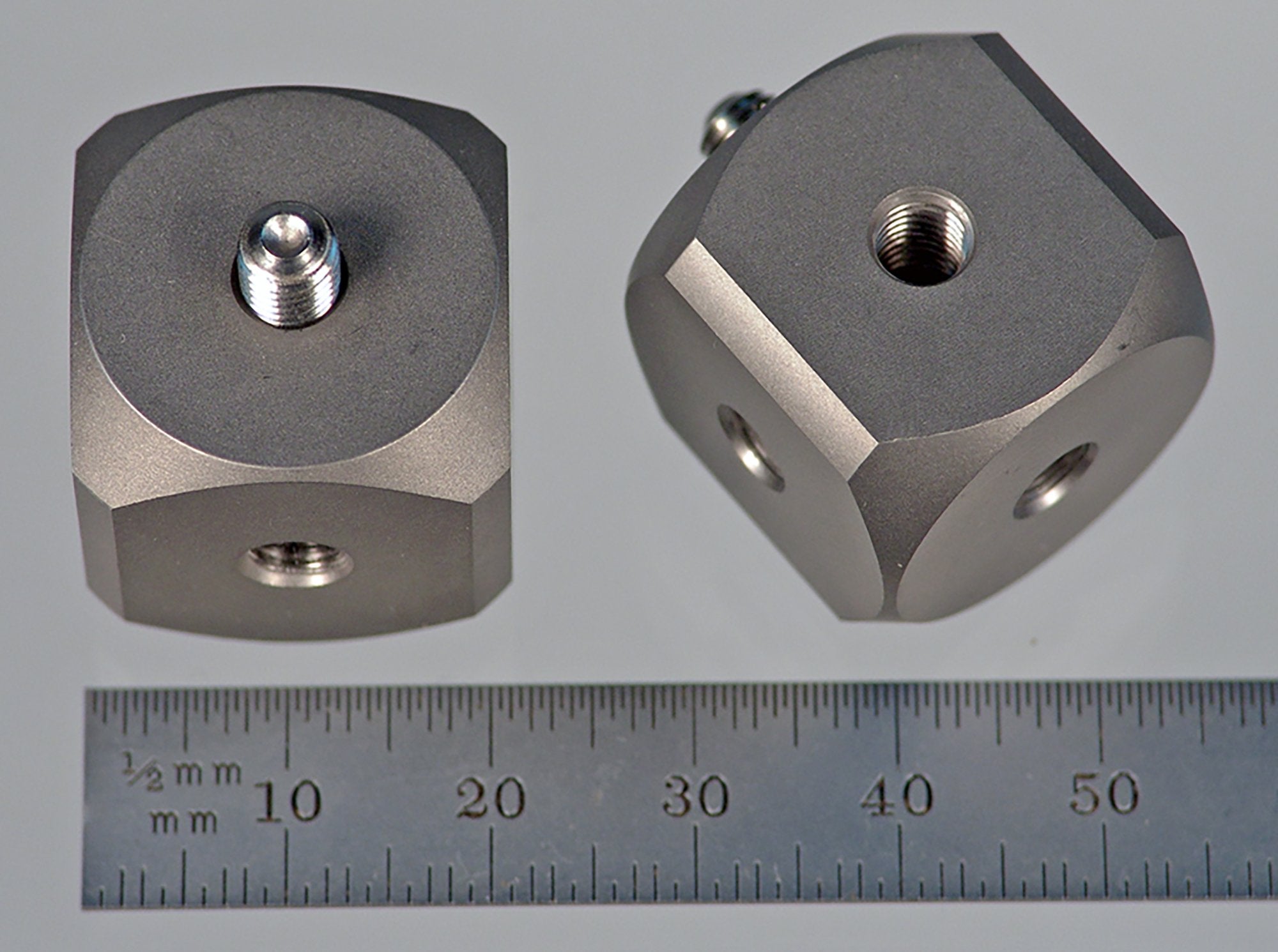 WM5-20-T M5 cube, 90 degree, solid titanium with stainless steel M5 screw.