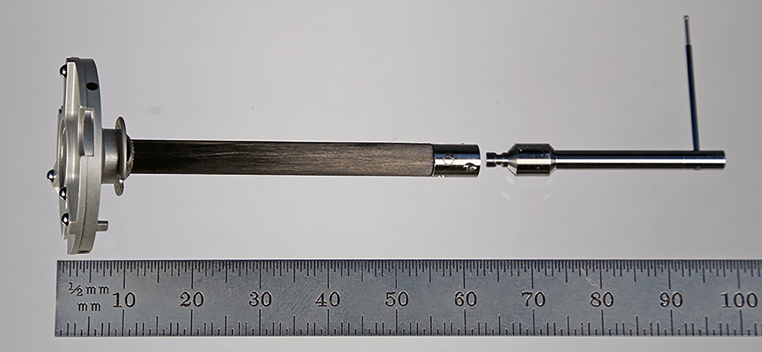 XXT-AP-ID3-EXT-PF adapter plate with gold-plated balls, carbon fiber extension, and conical receiver.